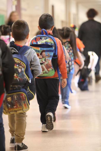 Line of students walking in the hallway