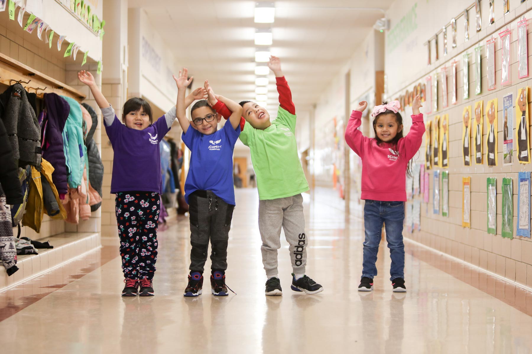 Group of students posing in the hallway