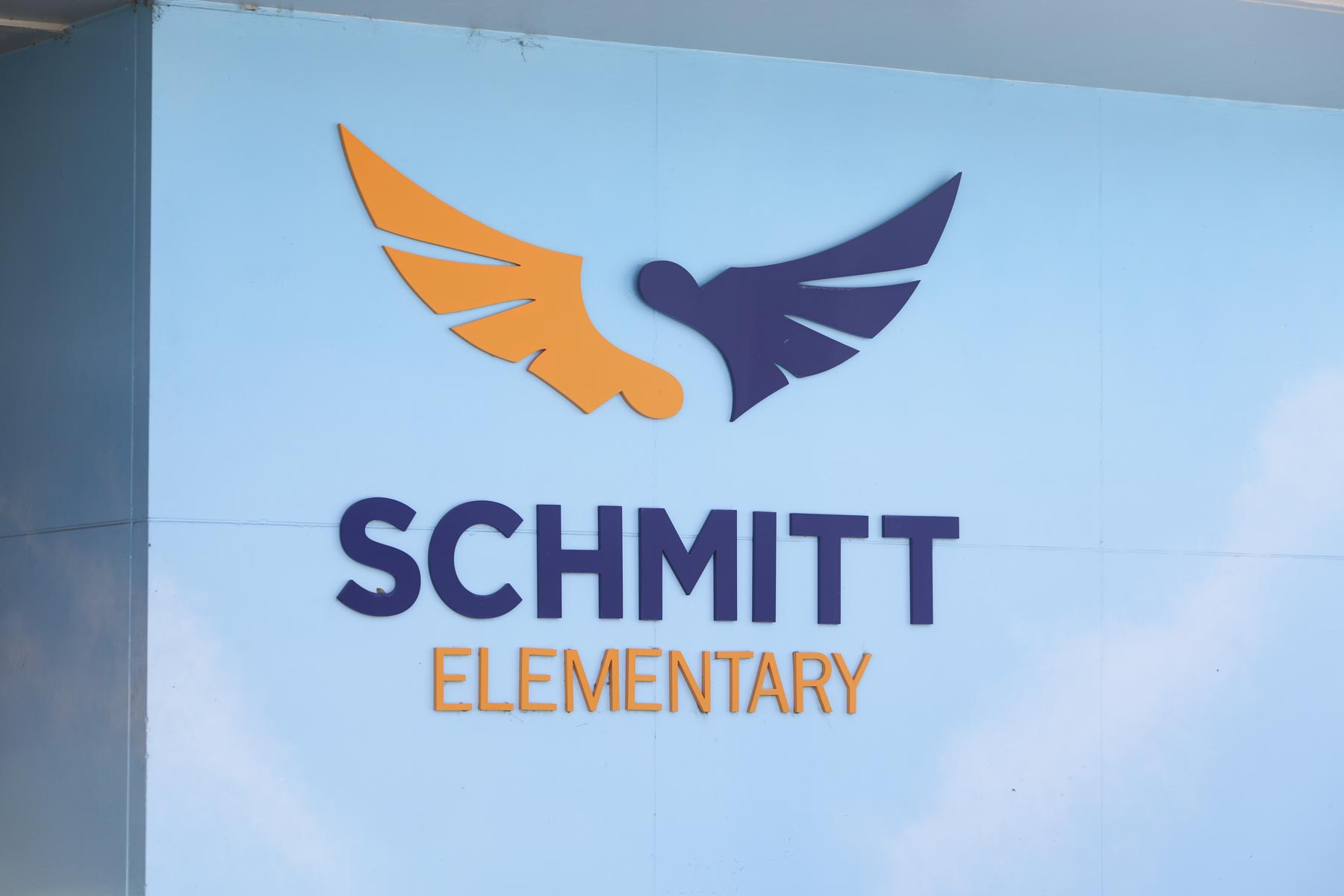 The Schmitt Elementary sign at the front of the school building